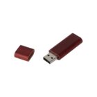 Wooden USB flash drive with its cap removed, lying on a white background.