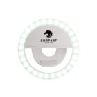 Round white ring light with a horse logo and the word Company on it.