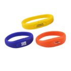 Three colored wristbands: yellow, blue, and orange with various logos and text.
