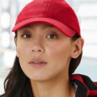 Person wearing a red cap, looking directly at the camera.