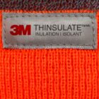 Gray 3M Thinsulate label on bright orange knit fabric.
