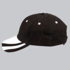 Black and white baseball cap with side view on a gray background.