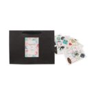 A black gift bag with floral Especially for you card and sheets of colorful stickers.