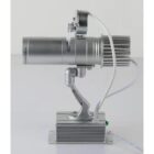 Side view of a silver LED spotlight with an articulated arm and visible wiring.