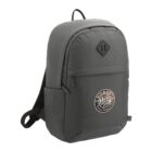 A gray backpack with a front pocket and a circular embroidered patch that says Jordan.