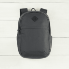 A plain dark gray backpack on a white wooden surface, viewed from above.