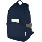 Navy blue backpack with a notebook in the front pocket and a laptop in the side pocket.