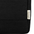 Black fabric bag with a small tag that reads Recycled Cotton on the side.