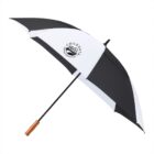 Black and white umbrella with a wooden handle and a Chordata logo on one white panel.