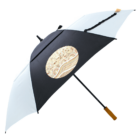 A black and white umbrella with a patterned beige circle in the center.
