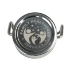 Round metal object with Family Healthcare Services and abstract family icon on top.