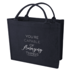 Black tote bag with the text Youre capable of amazing things printed on the front.