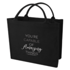Black tote bag with the text Youre capable of amazing things printed in white.