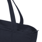 Close-up of a black fabric tote bag with handles and a zipper closure.