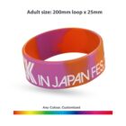 Multicolored silicone wristband with text, shown with size and color customization options.