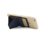 Gold smartphone with a black wallet attached, acting as a stand.