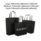 Three black tote bags in different sizes with size dimensions displayed above them.