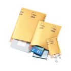 Three padded promotional mailers holding various office supplies.