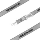 A gray lanyard with the word HEIDENHAIN printed in black. It features a metal hook and a plastic buckle with an icon of a person inside a circle. The lanyard is arranged with two diagonal sections at the top and bottom.