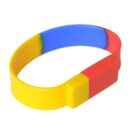 Multicolored rubber wristband in yellow, blue, and red.