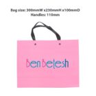 Pink Ben Betesh bag, black handles, dimensions listed above.