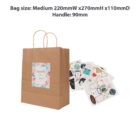 Brown gift bag with a floral design and sticker sheets nearby.