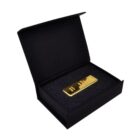 Gold bar in a black presentation box with a foam insert.