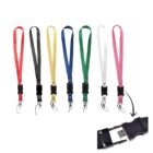 Seven colored lanyards with detachable clips and metal hooks are shown: red, black, yellow, green, blue, white, and pink. An inset shows a USB drive feature within a black lanyard clip.