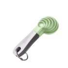 Stacked green measuring spoons on a metal ring, labeled with measurements.