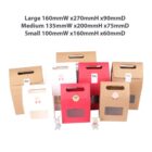 Assorted cardboard gift boxes in white, red, and brown with handle cutouts.