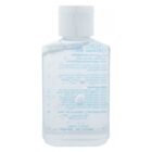 Clear bottle of hand sanitizer with a white cap, label text visible in reverse.