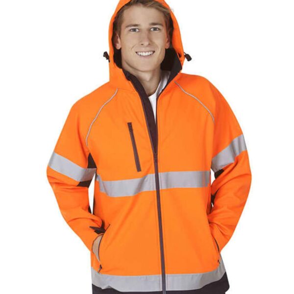 Person smiling, wearing a bright orange hooded jacket with gray reflective stripes. Hands in pockets. White background.