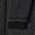 Close-up of a dark gray hoodie sleeve with a black ribbed cuff.