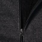 Close-up of a dark gray zip-up hoodie with a black inner lining.
