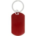 A red rectangular dog tag keychain with a silver key ring attached.