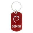 Red keychain with the white Debian logo and text on it.