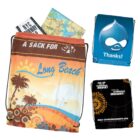 Three colorful drawstring bags, one with a Long Beach design and travel guides inside.