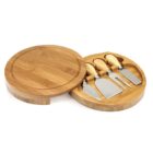 Round wooden cheese board with four cheese knives in a fitted compartment.