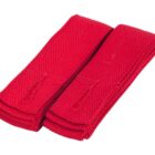 Two neatly folded red karate belts with visible stitching laid side by side against a white background.