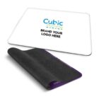 A rectangular white mouse pad with the text Cubic Promote and Brand Your Logo Here in the center. Part of the black bottom is flipped up, revealing a textured, non-slip surface.