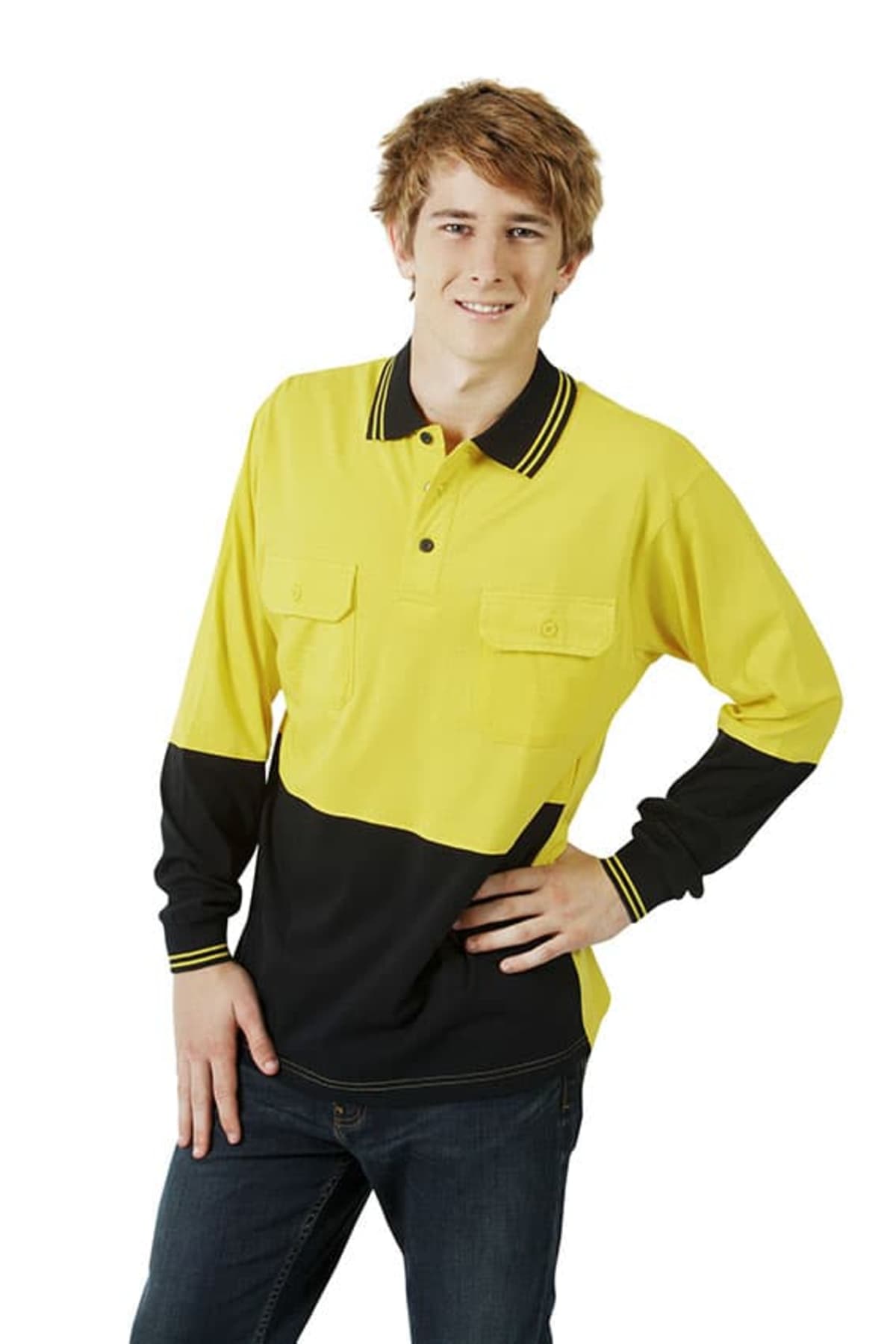 A young person poses with a hand on their hip, wearing a long-sleeve yellow and black polo shirt with buttoned pockets and dark jeans. They have short, light brown hair and smile at the camera against a white background.