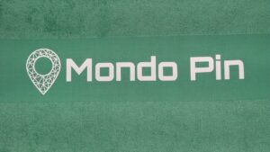 Promotional Green towel with printed Mondo Pin logo.