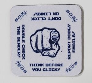 A coaster with a fist illustration and cybersecurity warnings like Think Before You Click.