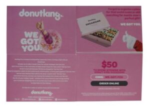 Donut King gift card ad with pink theme and box of assorted donuts. Text offers $50 for Donut King Occasions.