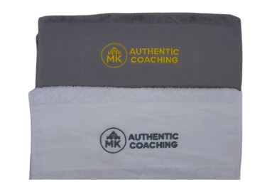 Gray and white branded sports towels with logos.