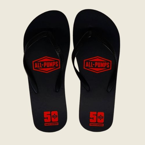 branded black flip flops with logo printed on it.