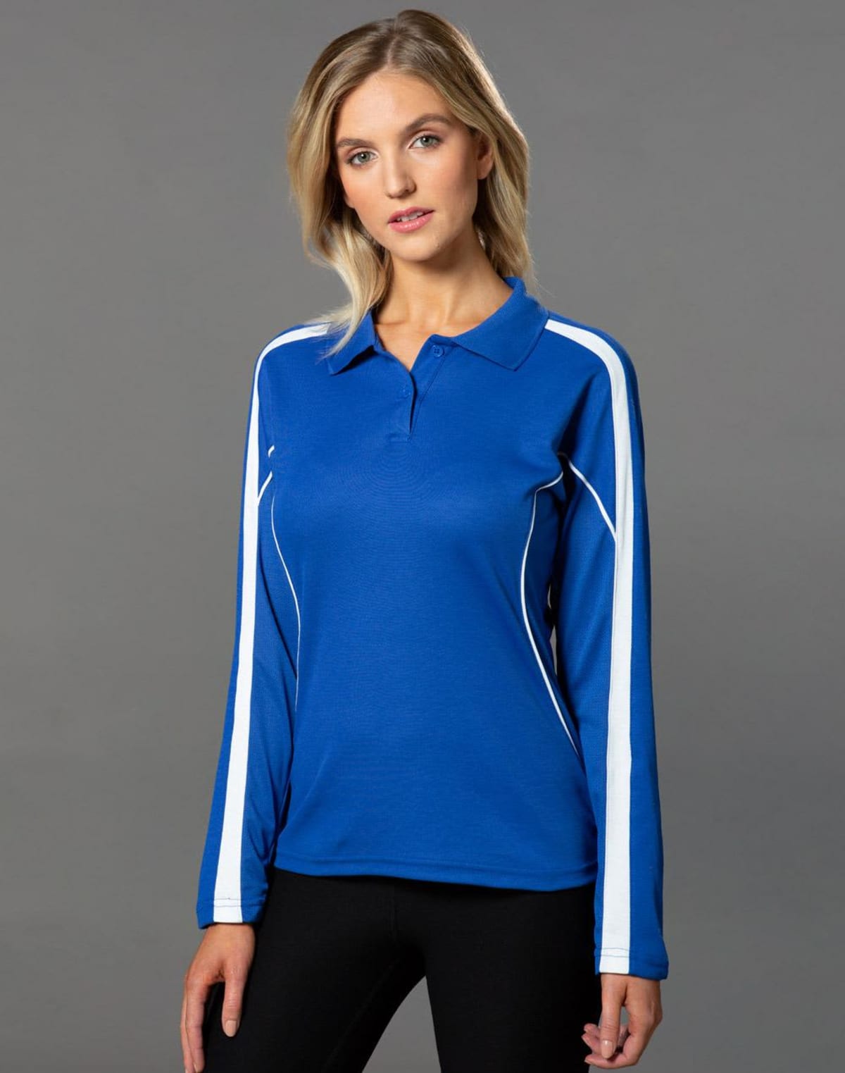 Person in a blue long-sleeve polo shirt with white stripes on gray background.