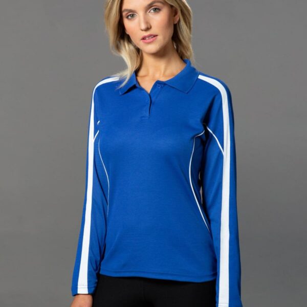Person wearing a blue and white long-sleeve polo shirt against a gray background.