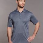 Man in a gray polo shirt poses against a gray background.