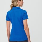 Person in a blue polo shirt and black pants, standing, viewed from the back.